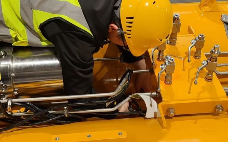 Service Engineer working on passive heave compensator