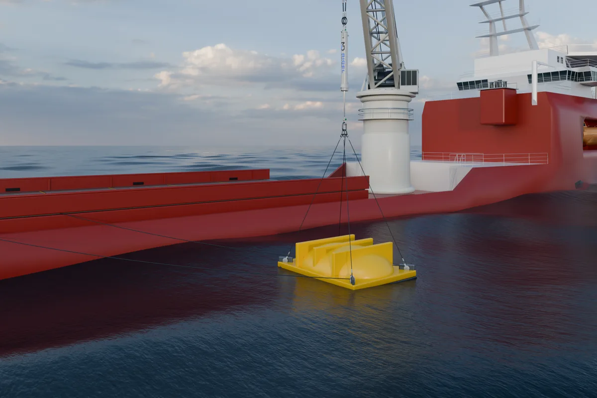 RIGEL and a yellow GRP cover crossing the waterline beside an offshore vessel.