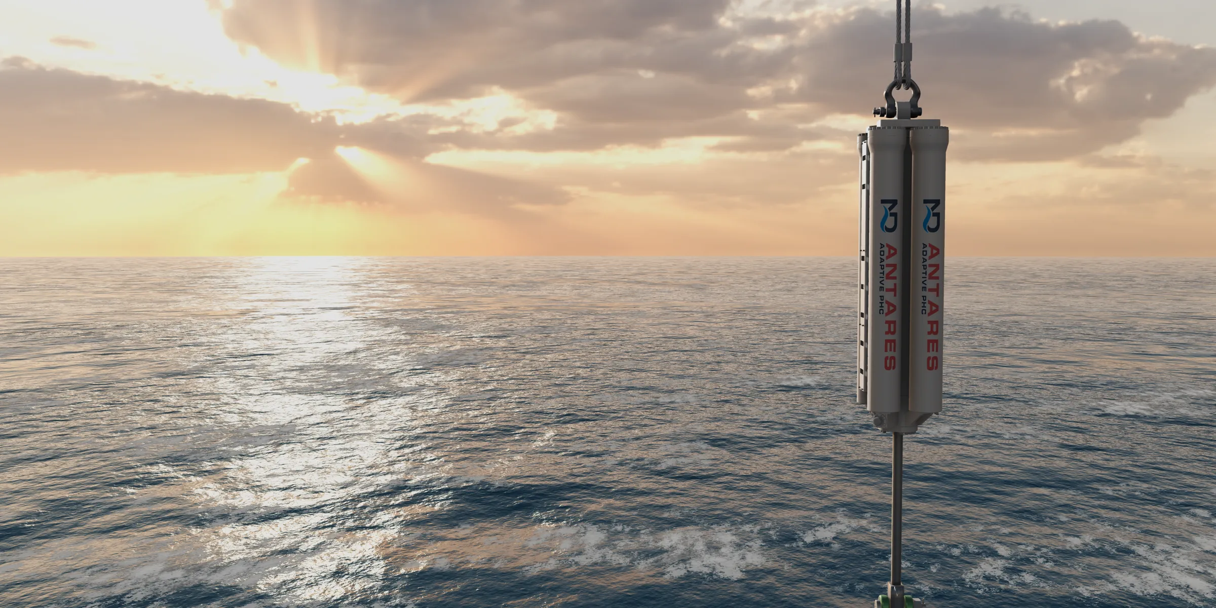 An ANTARES adaptive passive heave compensator hanging in the crane wire above a calm sea at golden hour, rendered by the CONSTELLATION simulator.